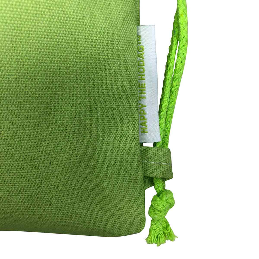 detail image of fabric side tab on drawstring backpack and product tag that reads Happy the Hodag TM