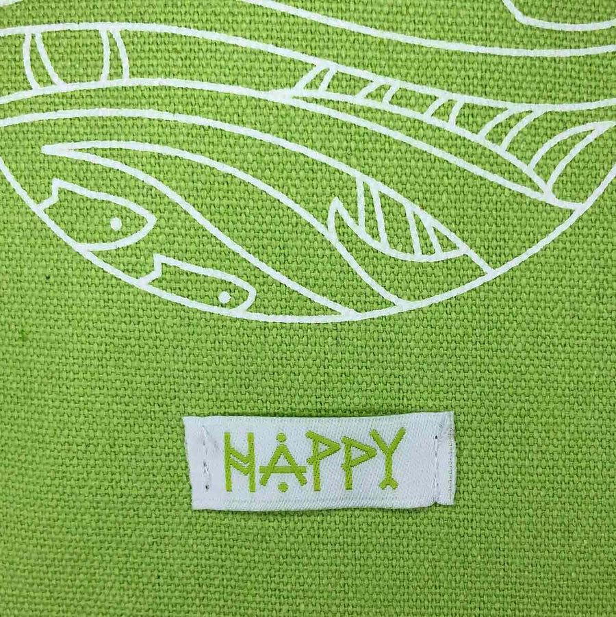detail image of white sewn on tab that reads happy