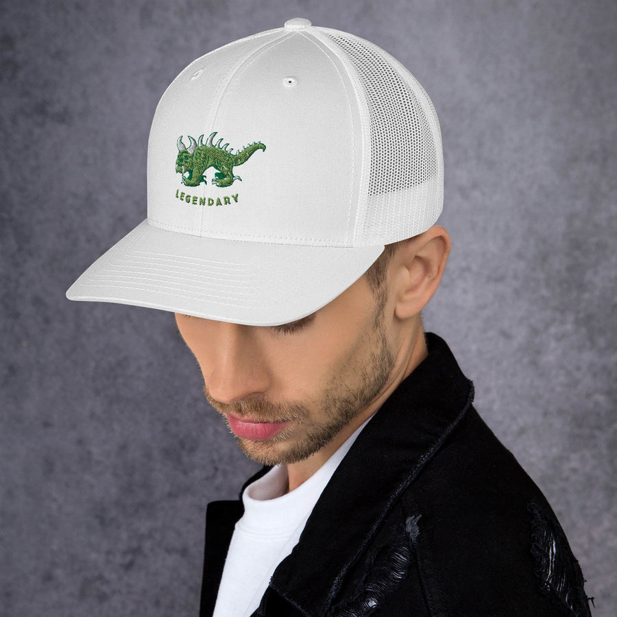 white trucker cap, angled view, with two tone green and white vintage embroidered Hodag with the word legendary underneath.