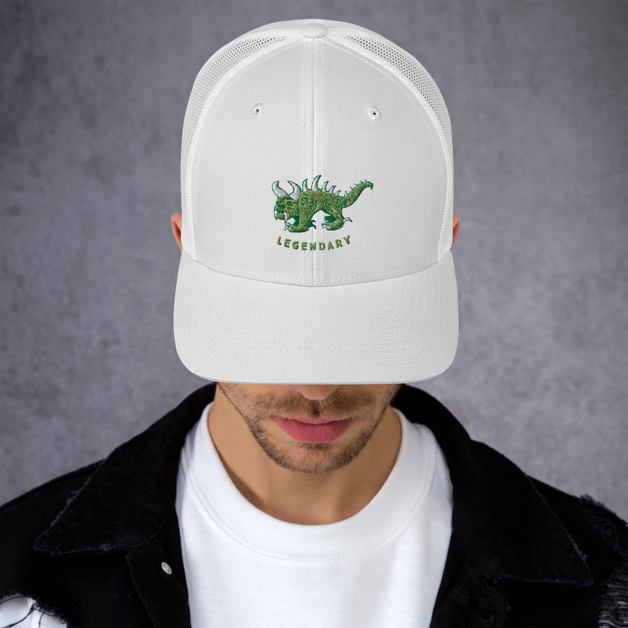 White trucker cap with two tone green and white vintage embroidered Hodag with the word legendary underneath.