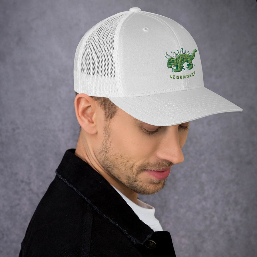 White trucker cap, angled view, with two tone green and white vintage embroidered Hodag with the word legendary underneath.